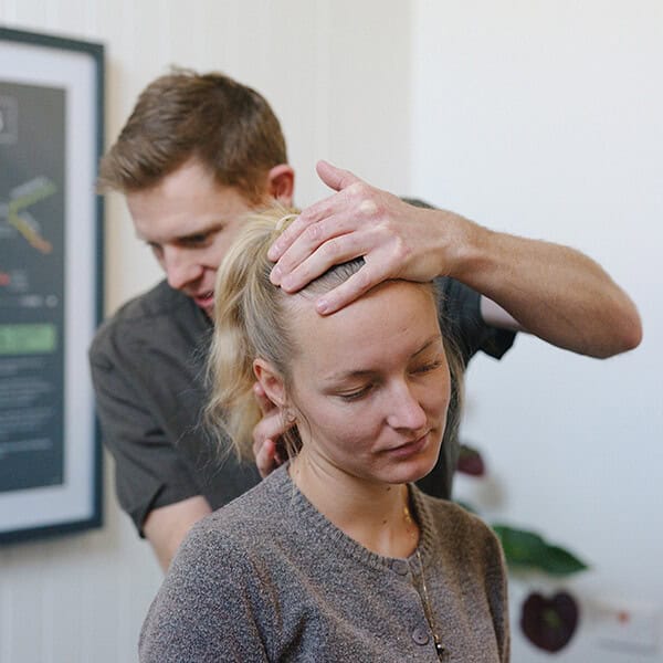 Chiropractor performing a neck assessment at The Chiro Pad, Nelson.